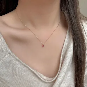 S925 silver red teardrop necklace for women worn on a soft textured sweater