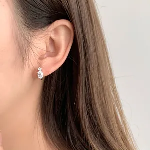 S925 sterling silver waterdrop zircon stud earrings worn on model for a luxury look