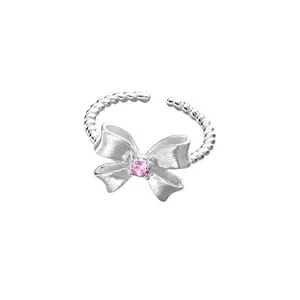 Anillo de plata S925 con diseño trenzado y lazo de circón rosa, ajustable y abierto