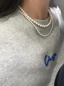 Detailed view of double-layered S925 silver necklace with premium round lustrous pearls