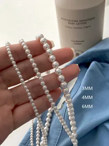 Detailed comparison of 3mm, 4mm, and 6mm white pearl necklaces showing size differences