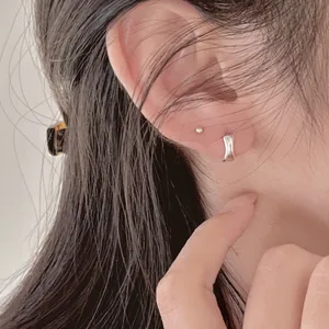 Minimalist S925 sterling silver irregular hoop earrings and stud worn by a female model