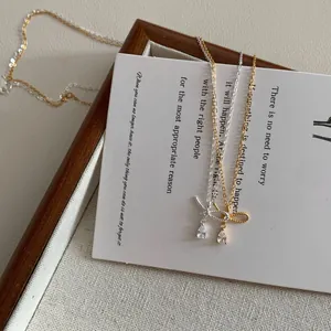 Elegant S925 silver bow necklace with waterdrop zircon in gold and silver finishes
