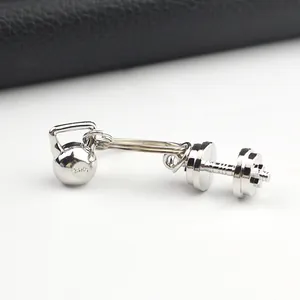 Silver metal keychain featuring miniature kettlebell and dumbbell charms for gym lovers