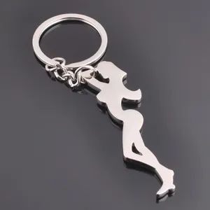 Polished silver metal keychain featuring a feminine silhouette pendant on a smooth surface