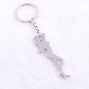Polished silver metal keychain featuring creative female silhouette pendant on white fur