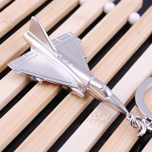 Polished silver metal fighter jet keychain with detailed f15 aircraft wing structure