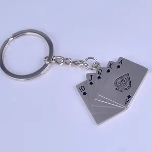 Close-up of royal flush poker metal keychain with matte silver finish and five spade cards