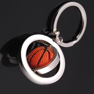 Rotating basketball keychain with orange rubber ball and polished silver metal ring