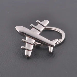 Polished silver metal airplane keychain with realistic 4-propeller vintage aircraft design