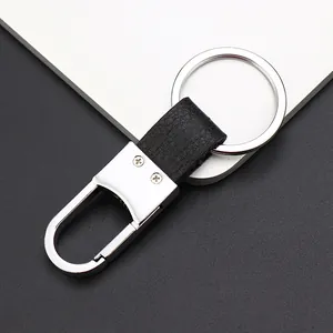Llavero de negocios clásico en metal plateado y cuero negro con gancho giratorio