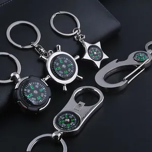 Macro detail of zinc alloy compass keychains with polished silver finish and black dials