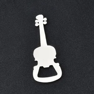 Macro shot of guitar-shaped silver metal beer bottle opener on a black textured background