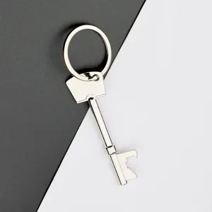 Close-up of creative key-shaped bottle opener in silver metal with a sturdy keychain