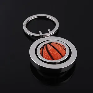 Rotating basketball keychain with orange rubber ball and polished silver metal ring