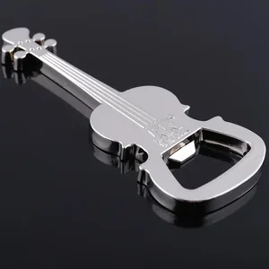 Macro detail of guitar shaped metal bottle opener with embossed logo on shiny silver finish