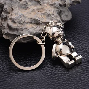 Polished silver movable 3D teddy bear metal keychain with round ring on black leather base