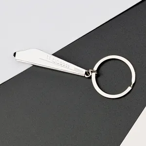 Macro shot of silver zinc alloy train keychain with streamlined high-speed rail design