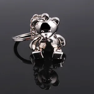 Polished silver metal teddy bear keychain with a 3D sitting bear pendant and ring