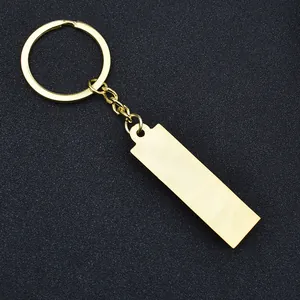 Detailed close-up of polished gold-plated rectangle pendant keychain for custom DIY engraving