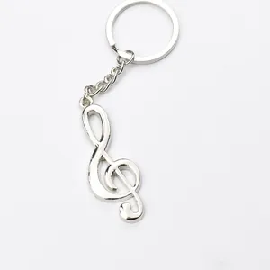 Portachiavi con chiave di violino in metallo lucido argento con catena e anello tondo