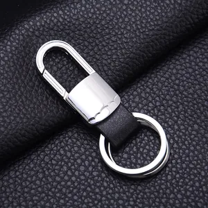 Close-up of business style metal keychain with black lychee leather and dual rings