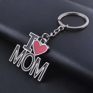 Detail of I Love MOM keychain with red heart and black enamel on silver metal
