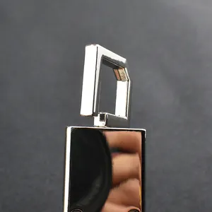 Close-up of polished chrome car keychain with shiny mirror finish and durable D-ring