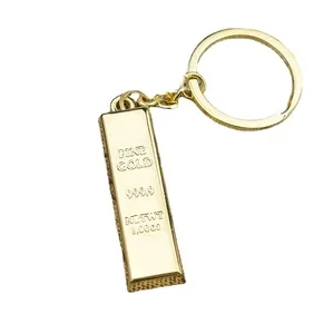 Polished gold bar keychain with 999.9 fine gold engraving on a white background