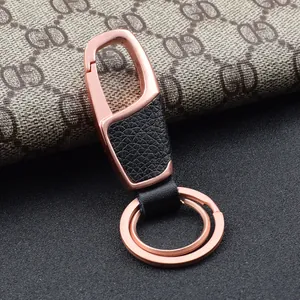 Detail of rose gold zinc alloy car keychain with premium black lychee texture leather