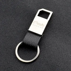 Business leather and metal keychain with custom logo engraving on black background