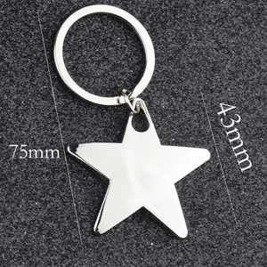 Polished silver star keychain with metal split ring shown with size measurements