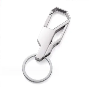 Detail view of matte silver metal keychain with geometric spring hook and flat ring