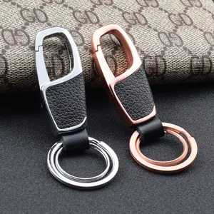 Premium leather and zinc alloy car keychains in silver and rose gold finishes