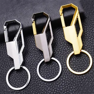 Sleek metallic car keychain set in silver, titanium grey and gold on black leather