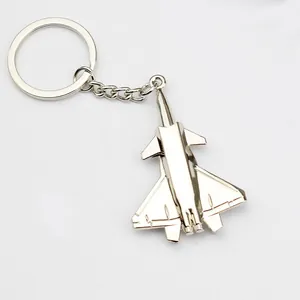 Macro view of fighter jet keychain detail with polished silver metallic finish