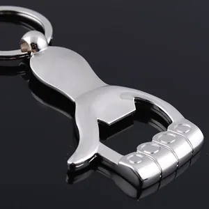 Macro detail of silver metal bottle opener keychain with car logo and keyring finish