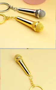 Detailed view of gold and silver microphone keychains with metallic mesh texture