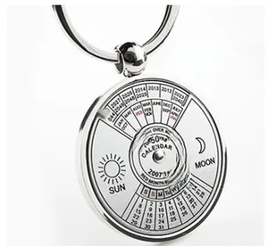 Detail of 50-year perpetual calendar keychain made of polished silver alloy metal