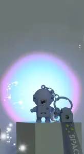 Glow-in-the-dark astronaut keychain with sunset projection light and space hand strap