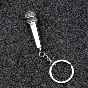 Polished silver microphone keychain made of zinc alloy with realistic mesh texture
