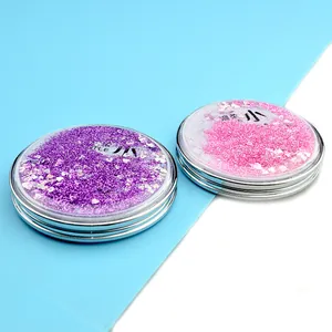 Detail showing round folding mirror with glitter sand cover in purple and pink styles