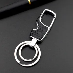 Detailed view of dual-ring metal keychain featuring a bottle opener and honeycomb texture