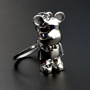 Silver electroplated bear keychain with mirror finish and metallic bow-knot pendant
