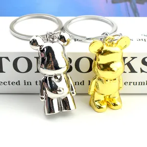 Gold and silver metallic bear keychains with bow tie detail for couples and bags