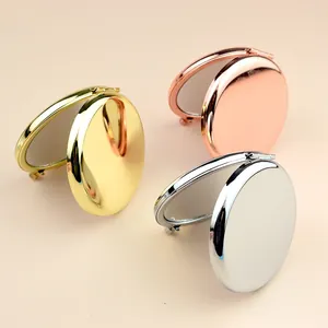 Portable round folding makeup mirror in gold, rose gold and silver metal finishes