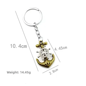 Retro nautical keychain with spinning silver steering wheel and bronze anchor pendant