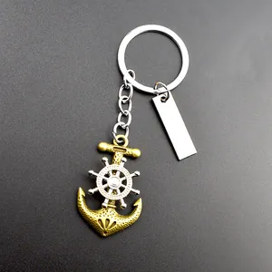 Vintage brass anchor and silver spinning ship wheel keychain with customizable metal tag