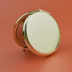 Portable double-sided gold metal folding makeup mirror with compact round design