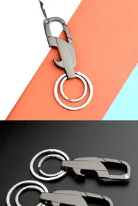 Detail of grey multi-tool keychain featuring folding blade and bottle opener functions